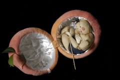 Momotaro emerges from his peach.